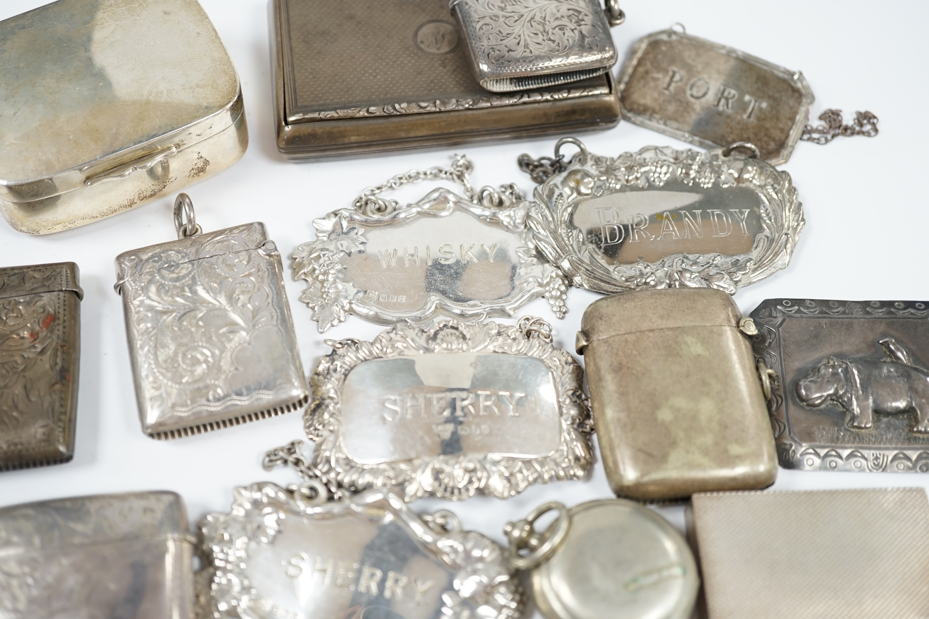 Sundry small silver and plated items including wine labels, vest cases, sovereign case and a Victorian silver snuff box, London, 1841, 79mm. Condition - poor to fair to good